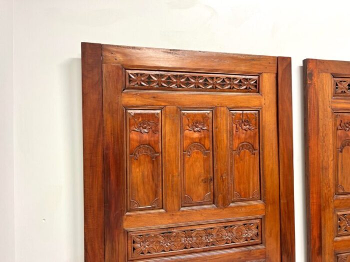 20th century carved balinese mahogany doors converted to headboards pair 1899