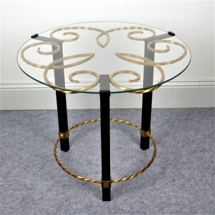 gilded black lacquered metal gueridon with glass top 1950s 1