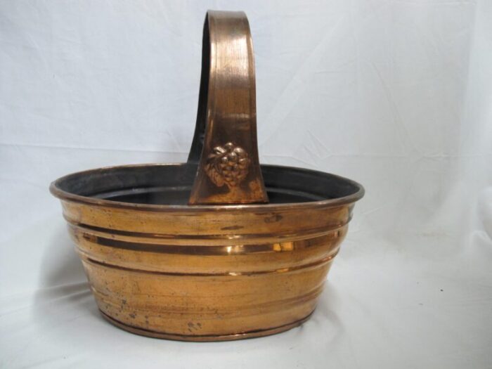 large vintage copper rustic basket with grape bunch design at handle 6553