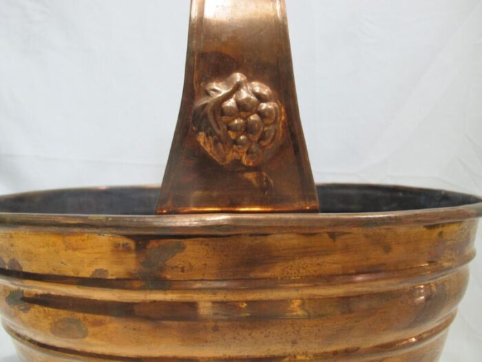 large vintage copper rustic basket with grape bunch design at handle 9232