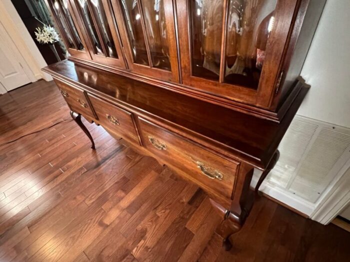 late 20th century vintage colonial style solid cherry china cabinet with bubble glass doors and cabriole legs 5581