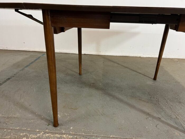 mid century modern walnut 60 drop leaf dining table by h p browning 3085