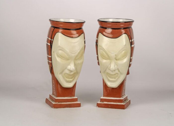 pair of antique french vases made of hand painted unglazed porcelain representing two facesmasks signed by aladin 0619