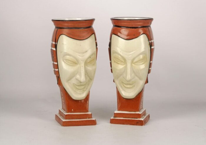 pair of antique french vases made of hand painted unglazed porcelain representing two facesmasks signed by aladin 3186