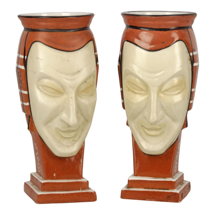 pair of antique french vases made of hand painted unglazed porcelain representing two facesmasks signed by aladin 9910