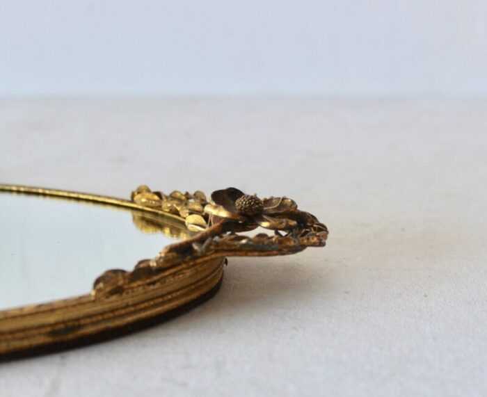 vintage mid century oval vanity makeup tray gold brass finish sculptural flower detail 0081