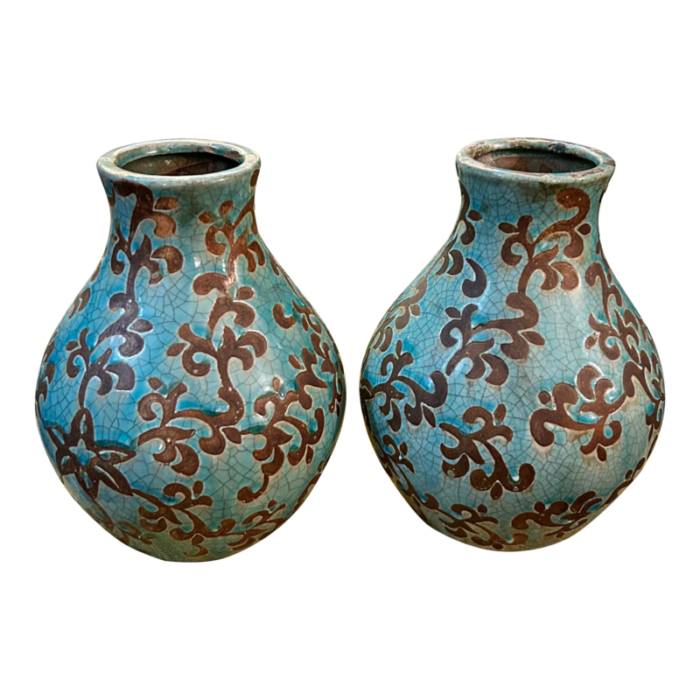 vintage pair of carved pottery with foliate design 1559